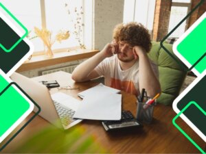 Caucasian-man-upset-and-desperate-seeing-falling-financial-and-economic-charts