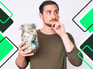 young-man-holding-jar-with-serious-face-of-savings-thinking-about-issue-with-hand-on-chin-thoughtful-about-saving-money