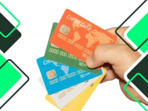 Types of credit cards: person-holding-some-colorful-credit-cards-over-a-white